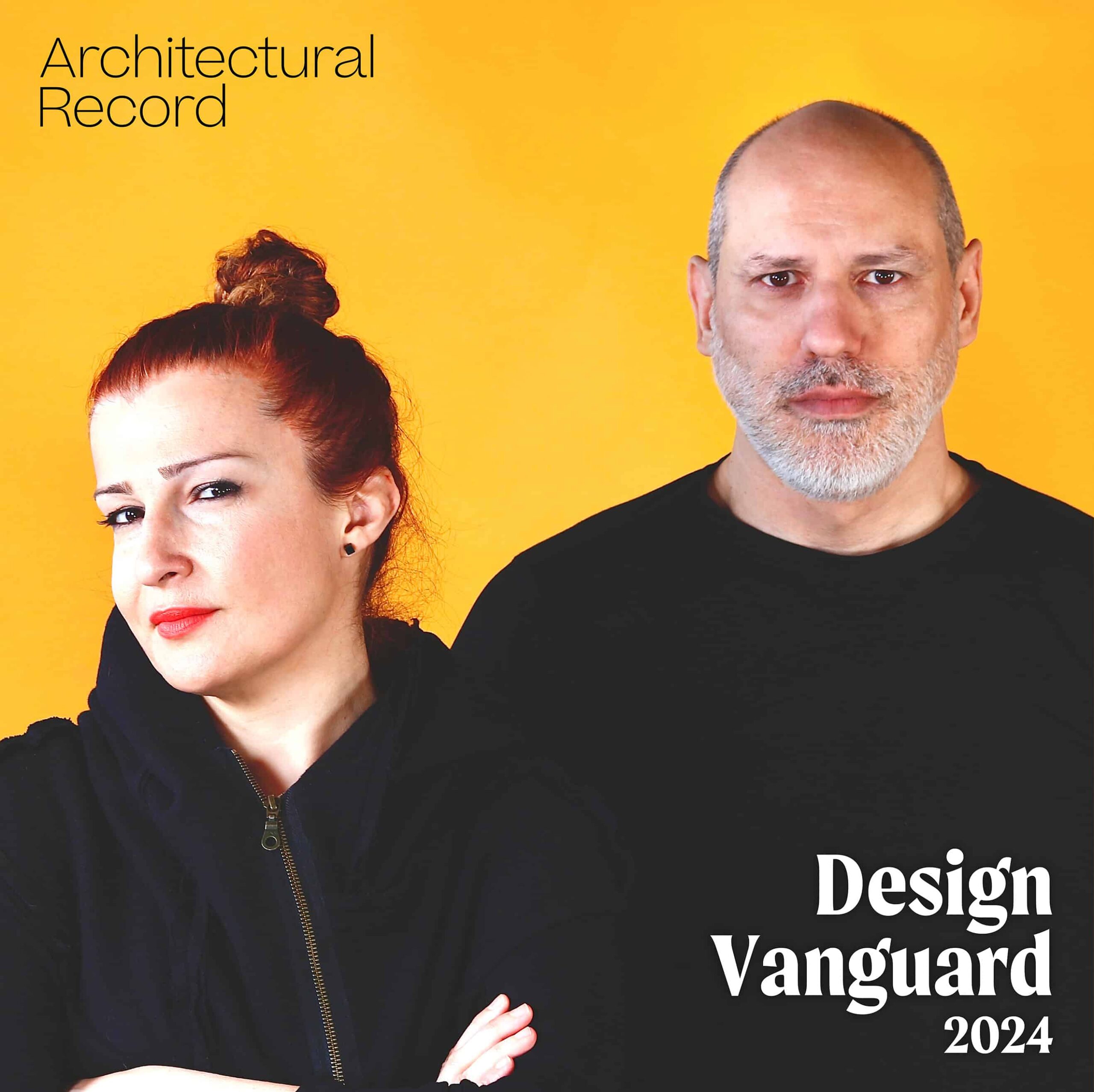 Neyran Turan and Mete Sonmez pose in black clothing in front of orange background. In the bottom right corner, there is text that reads "Design Vanguard 2024."