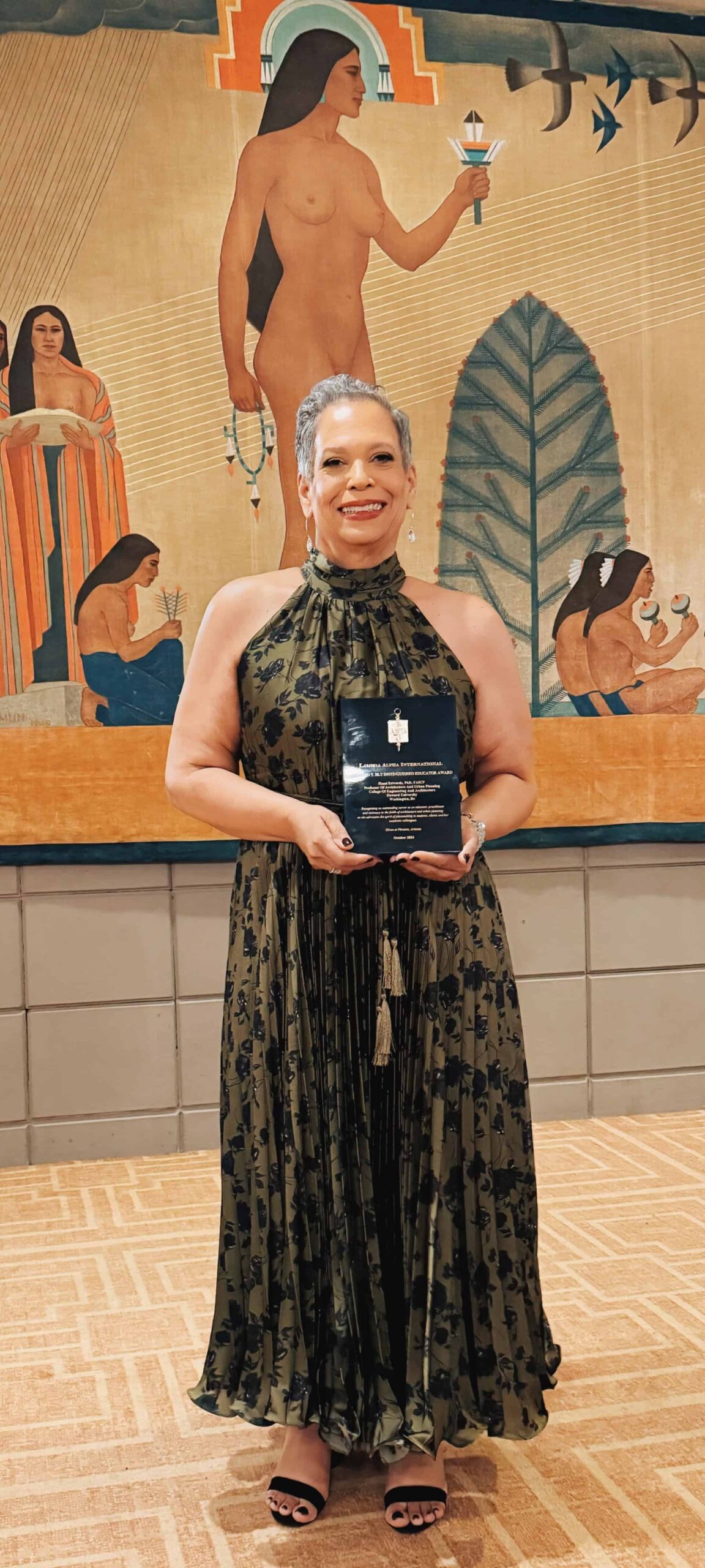 Hazel Ruth Edwards holding award plaque